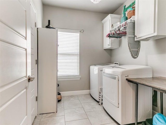 1405 Atalon Dr, Moore, OK 73160 - washroom featuring cabinet space, separate washer and dryer, light marble finish flooring, and baseboards