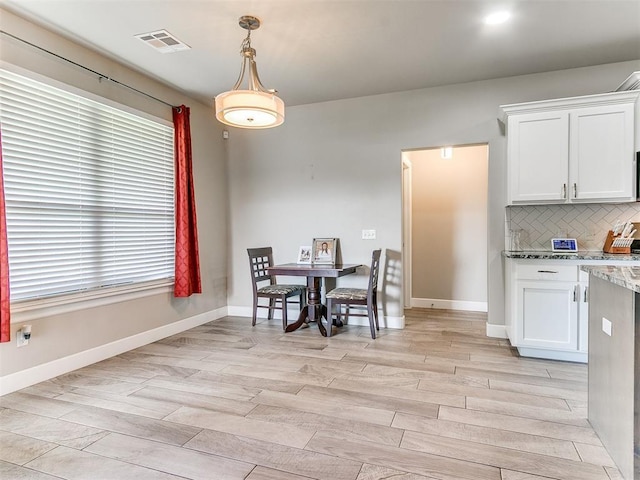 1405 Atalon Dr, Moore, OK 73160 - dining space with light wood finished floors and baseboards