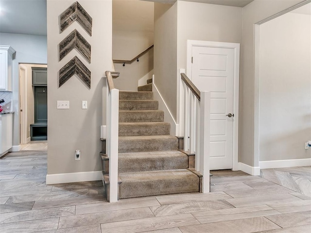 1405 Atalon Dr, Moore, OK 73160 - staircase featuring baseboards and wood finished floors