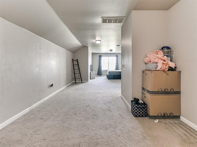 1405 Atalon Dr, Moore, OK 73160 - hall featuring carpet flooring, baseboards, and lofted ceiling