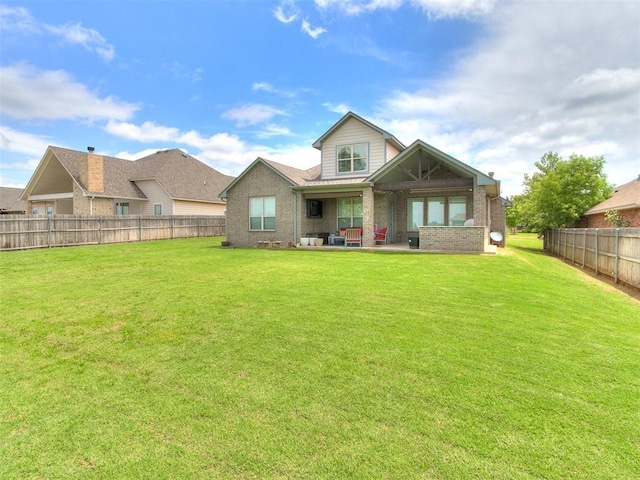 1405 Atalon Dr, Moore, OK 73160 - rear view of property with a patio and brick siding