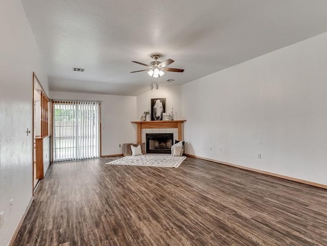 2121 NE 13th St, Moore, OK 73160 - unfurnished living room featuring dark wood-style flooring, a fireplace, ceiling fan, and baseboards
