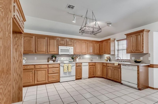 2121 NE 13th St, Moore, OK 73160 - kitchen featuring white appliances, light countertops, a sink, and light tile patterned floors