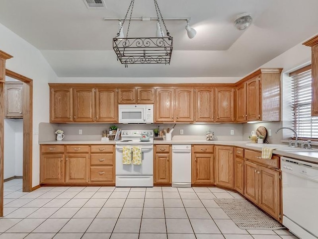 2121 NE 13th St, Moore, OK 73160 - kitchen featuring white appliances, light countertops, a sink, lofted ceiling, and light tile patterned floors