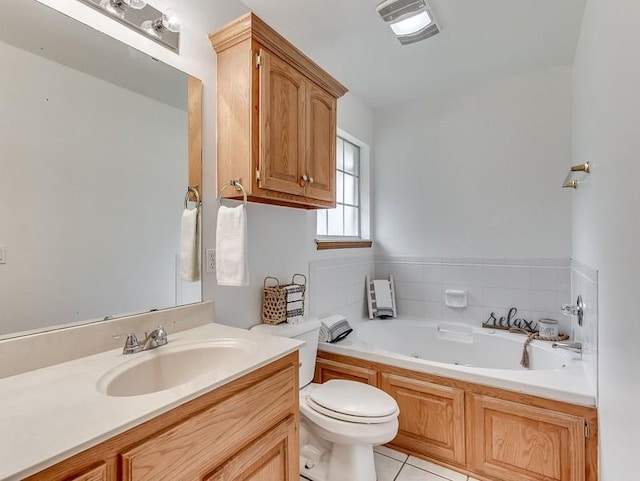 2121 NE 13th St, Moore, OK 73160 - full bath featuring a jetted tub, vanity, toilet, and tile patterned floors
