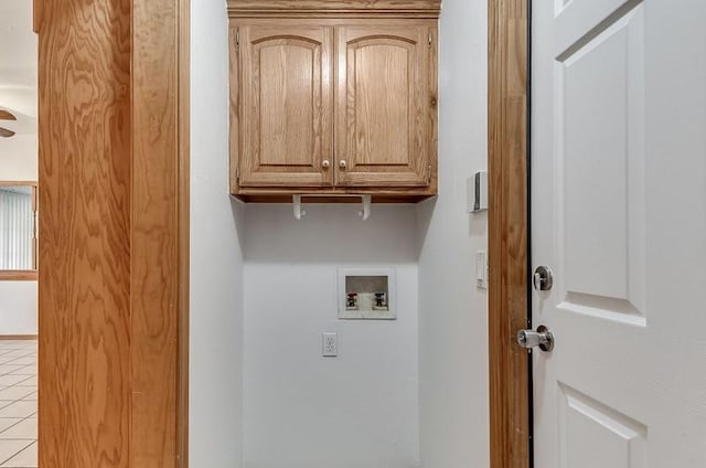 2121 NE 13th St, Moore, OK 73160 - laundry room with cabinet space, hookup for a washing machine, and light tile patterned flooring