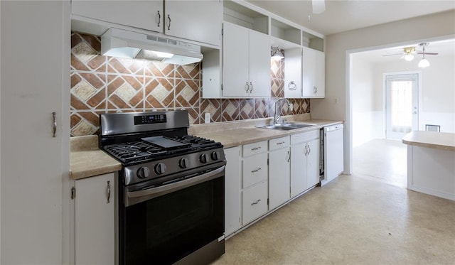 515 N Booth Ave, Elk City, OK 73644 - kitchen featuring stainless steel gas range, under cabinet range hood, a ceiling fan, a sink, and decorative backsplash