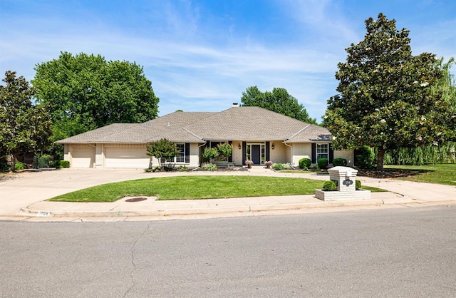1704 Faircloud Dr, Edmond, OK 73034 - single story home featuring an attached garage, driveway, and a front lawn