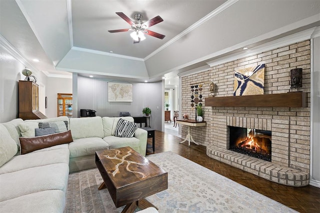 1704 Faircloud Dr, Edmond, OK 73034 - living room with a ceiling fan, a brick fireplace, and ornamental molding