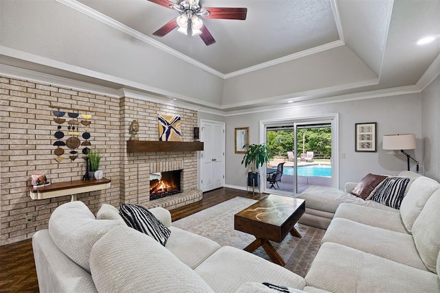 1704 Faircloud Dr, Edmond, OK 73034 - living area featuring ceiling fan, a fireplace, and a raised ceiling