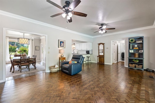1704 Faircloud Dr, Edmond, OK 73034 - living area with ceiling fan, baseboards, and ornamental molding
