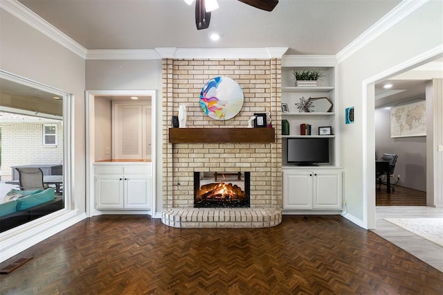 1704 Faircloud Dr, Edmond, OK 73034 - living room featuring a fireplace, ceiling fan, ornamental molding, a desk, and baseboards