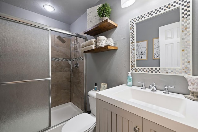 1704 Faircloud Dr, Edmond, OK 73034 - bathroom with toilet, vanity, a stall shower, and a textured wall