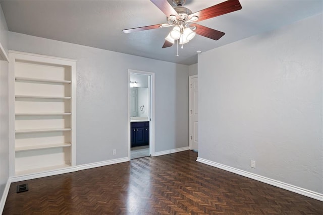 1704 Faircloud Dr, Edmond, OK 73034 - unfurnished bedroom with baseboards, ensuite bathroom, and ceiling fan