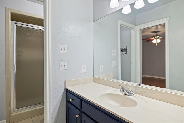 1704 Faircloud Dr, Edmond, OK 73034 - full bathroom with a shower stall, vanity, and ceiling fan