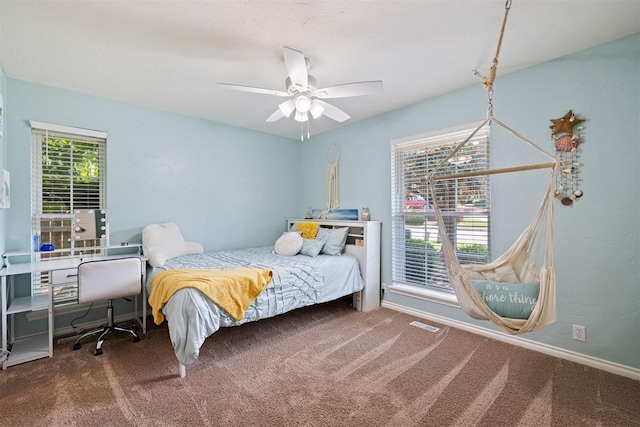 1704 Faircloud Dr, Edmond, OK 73034 - carpeted bedroom with a ceiling fan and baseboards
