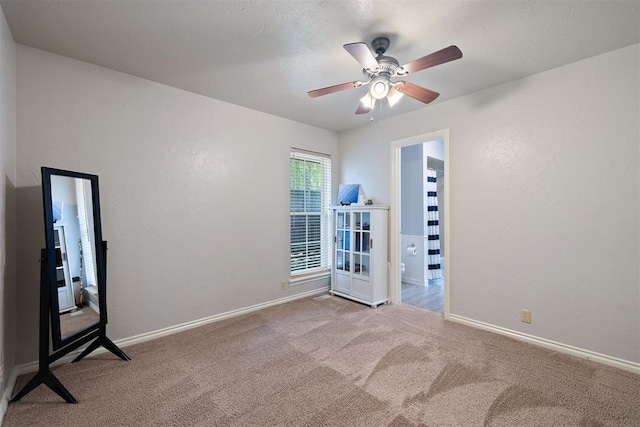 1704 Faircloud Dr, Edmond, OK 73034 - carpeted empty room with a ceiling fan and baseboards