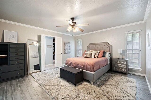 1704 Faircloud Dr, Edmond, OK 73034 - bedroom featuring multiple windows, ornamental molding, wood finished floors, and baseboards