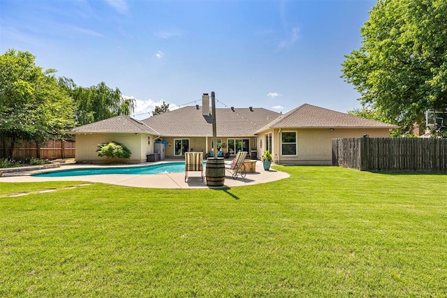1704 Faircloud Dr, Edmond, OK 73034 - back of property with a patio, brick siding, and a chimney