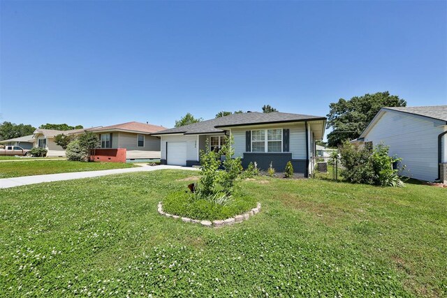 1206 Monroe Dr, Shawnee, OK 74804 - view of front of property with a garage, a front lawn, and concrete driveway