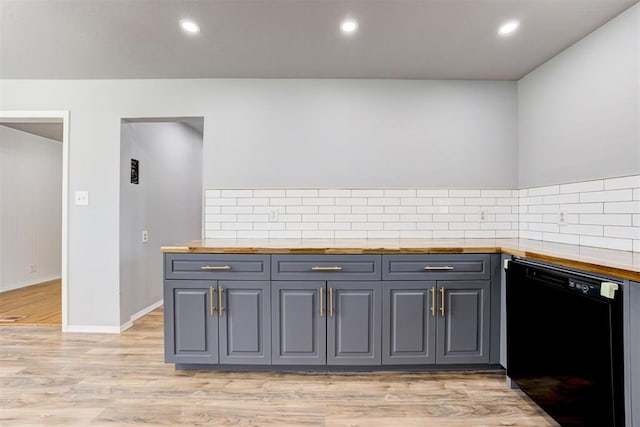 1206 Monroe Dr, Shawnee, OK 74804 - kitchen featuring dishwasher, butcher block counters, backsplash, light wood-style flooring, and recessed lighting