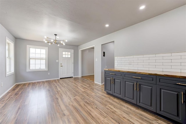 1206 Monroe Dr, Shawnee, OK 74804 - entrance foyer featuring a chandelier, light wood-type flooring, baseboards, and recessed lighting