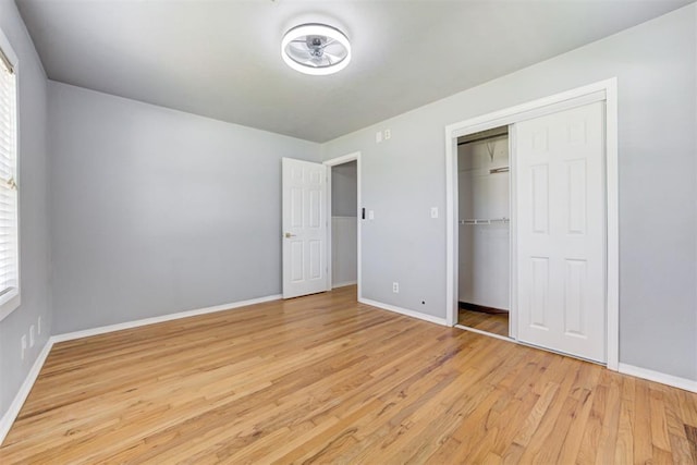 1206 Monroe Dr, Shawnee, OK 74804 - unfurnished bedroom featuring light wood-style flooring, baseboards, and a closet