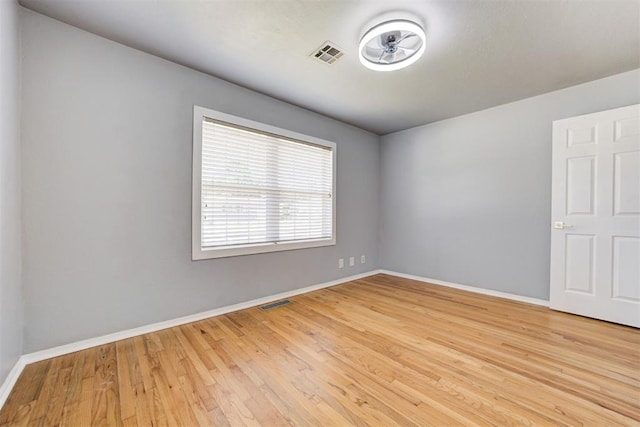 1206 Monroe Dr, Shawnee, OK 74804 - empty room featuring baseboards and wood finished floors