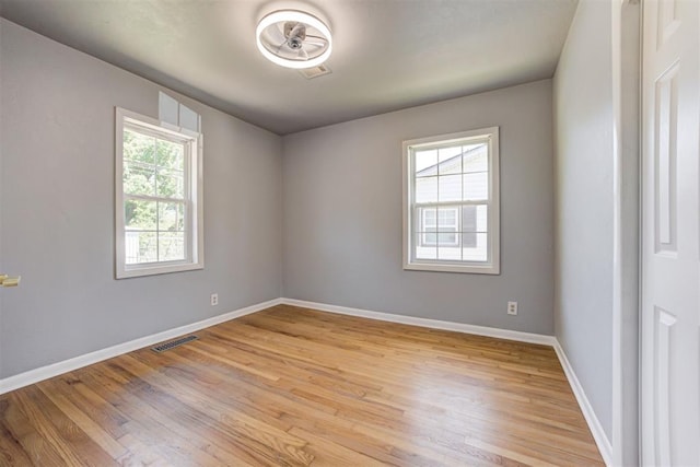 1206 Monroe Dr, Shawnee, OK 74804 - spare room with light wood finished floors and baseboards