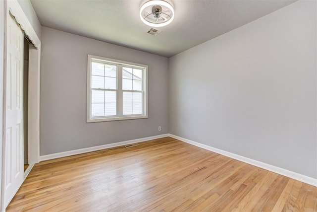 1206 Monroe Dr, Shawnee, OK 74804 - unfurnished bedroom with light wood-style floors, baseboards, and a closet