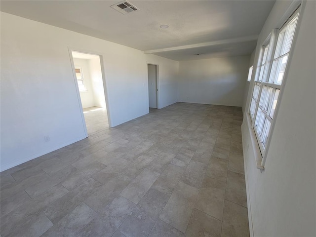 1228 Santa Fe Dr, Clinton, OK 73601 - spare room with healthy amount of natural light and baseboards