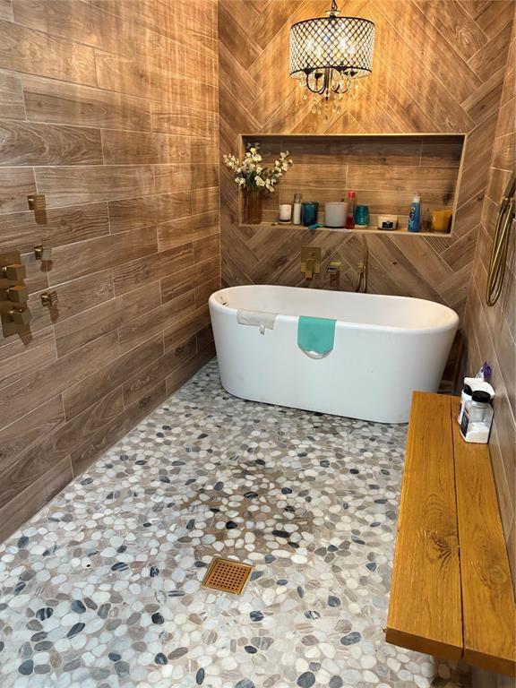 32629 S Airline Rd, Pauls Valley, OK 73075 - full bathroom with a soaking tub and a chandelier