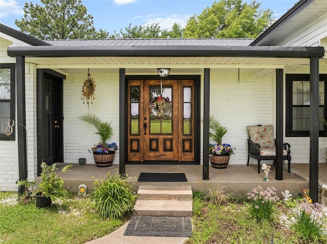32629 S Airline Rd, Pauls Valley, OK 73075 - entrance to property with brick siding, a porch, and a metal roof