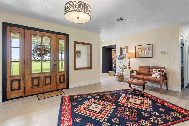 32629 S Airline Rd, Pauls Valley, OK 73075 - foyer entrance with wood finished floors and a textured ceiling