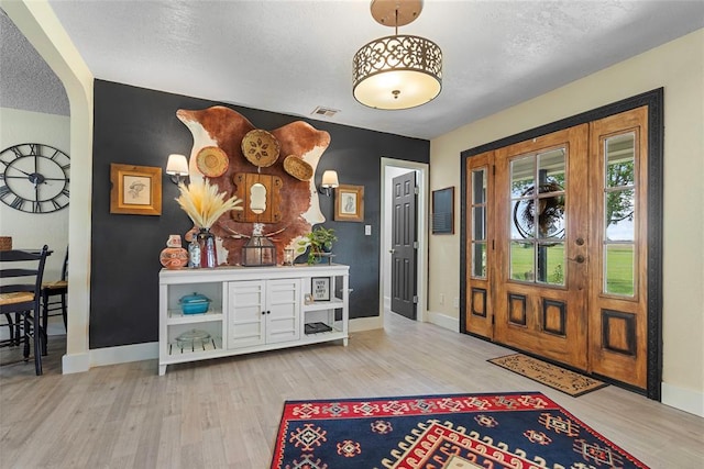 32629 S Airline Rd, Pauls Valley, OK 73075 - entryway featuring wood finished floors and arched walkways