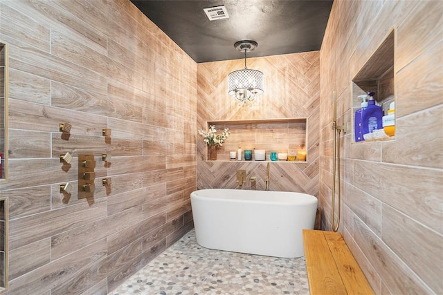 32629 S Airline Rd, Pauls Valley, OK 73075 - full bathroom featuring a freestanding tub, a tile shower, and a chandelier