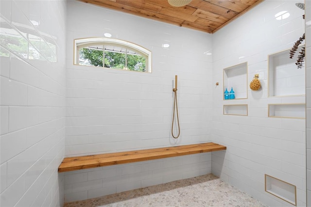 32629 S Airline Rd, Pauls Valley, OK 73075 - bathroom featuring a tile shower, wood ceiling, and speckled floor