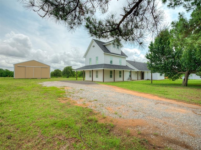 4100 S Noma Rd, Oklahoma City, OK 73150 - farmhouse-style home with a front lawn, driveway, and a shingled roof