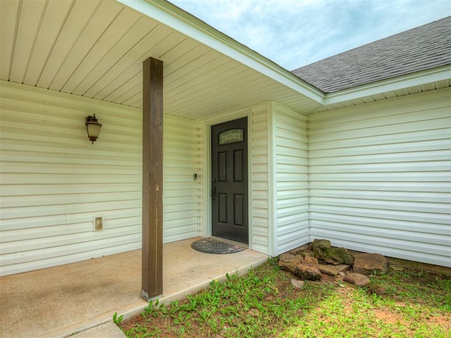 4100 S Noma Rd, Oklahoma City, OK 73150 - view of exterior entry featuring a shingled roof and a porch
