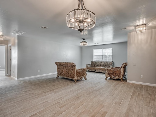 4100 S Noma Rd, Oklahoma City, OK 73150 - sitting room featuring light wood-style flooring, baseboards, and a chandelier