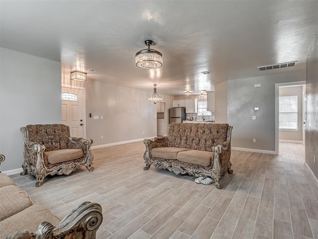4100 S Noma Rd, Oklahoma City, OK 73150 - living area featuring baseboards and light wood finished floors