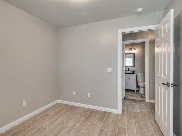 4100 S Noma Rd, Oklahoma City, OK 73150 - spare room with light wood-type flooring, baseboards, and a smoke detector