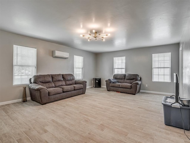 4100 S Noma Rd, Oklahoma City, OK 73150 - living area featuring an AC wall unit, a chandelier, light wood-style flooring, and baseboards