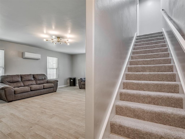 4100 S Noma Rd, Oklahoma City, OK 73150 - stairs featuring a wall mounted AC, a chandelier, wood finished floors, and baseboards