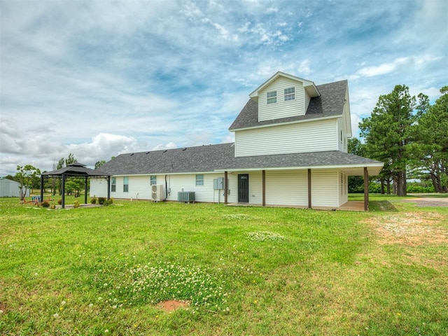 4100 S Noma Rd, Oklahoma City, OK 73150 - back of property with a gazebo, a lawn, a shingled roof, and central air condition unit