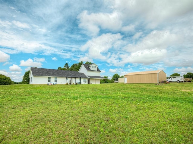 4100 S Noma Rd, Oklahoma City, OK 73150 - rear view of house featuring a lawn and an outbuilding