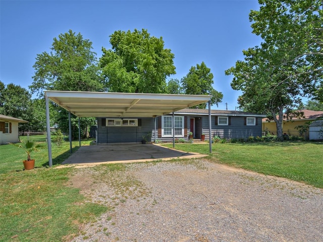 303 W Meek St, Wayne, OK 73095 - view of front of property with driveway, a front yard, and a carport