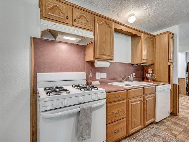 303 W Meek St, Wayne, OK 73095 - kitchen with white appliances, under cabinet range hood, a sink, light countertops, and a textured ceiling