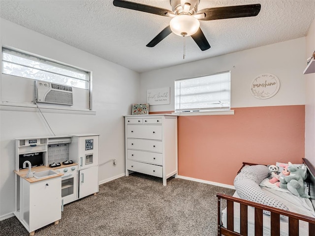 303 W Meek St, Wayne, OK 73095 - carpeted bedroom featuring multiple windows, a textured ceiling, cooling unit, baseboards, and ceiling fan