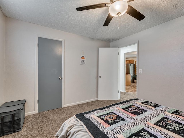 303 W Meek St, Wayne, OK 73095 - carpeted bedroom featuring a textured ceiling and ceiling fan